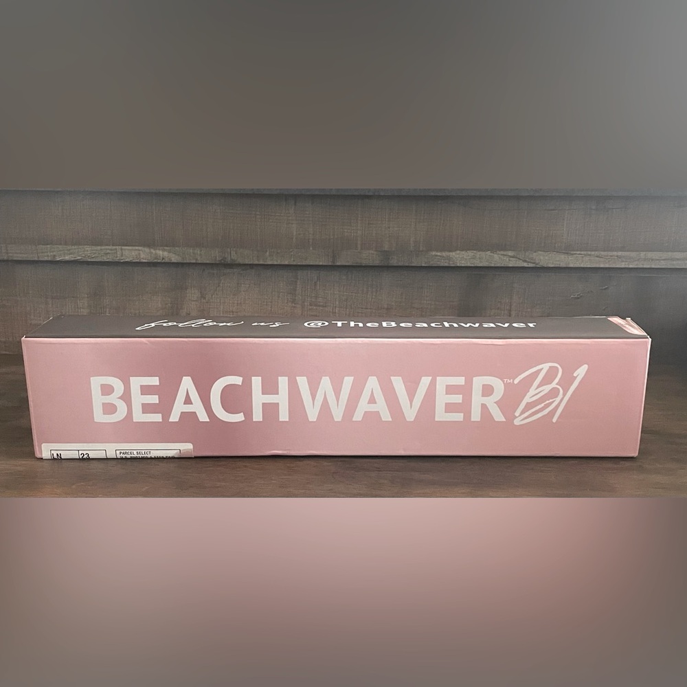 New in box. Beachwaver B1 Pink Curling Iron. Never used.